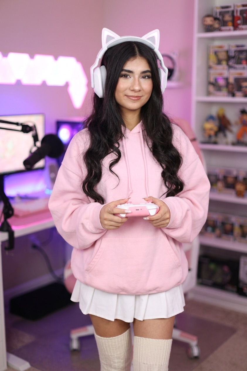 Sofia streaming in pink hoodie with cat-ear headphones